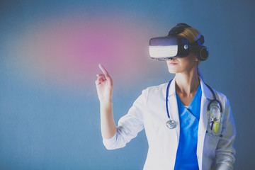 Female doctor wearing virtual reality glasses isolated on white background