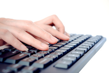 Hands typing on the keyboard