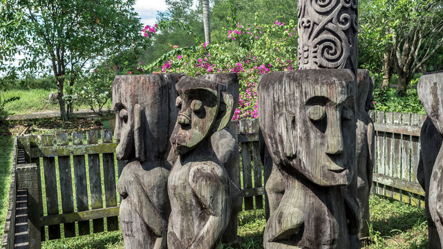 Configuration of traditional dayaknese (Indigenous tribe of Borneo / Kalimantan) wood sculptures / totem, in Pulau Kumala, Tenggarong, Indonesia