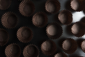 muffin bowls on black background. Dark baking background for magazines