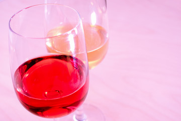 Two glasses with white and red wine