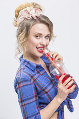 Youth Lifestyle Concepts. Portrait of Happy Smiling Caucasian Blond Woman with Cup of Colorful Juice and Straw.Posing Against White