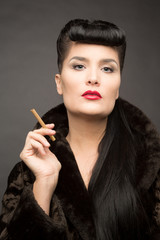 Obraz premium Beautiful lady with cigarette in fur coat. Cyberpunk theme. 