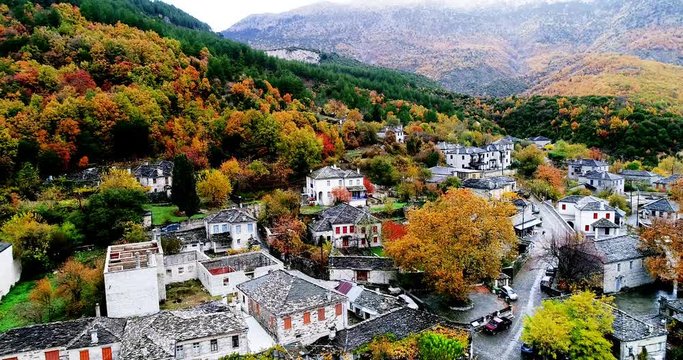 Aerial flight with drone over the old stone houses in the village Papingo, Greece