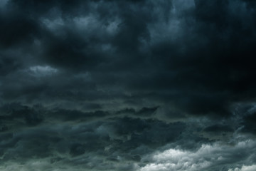 Naklejka na ściany i meble Dark sky and black clouds, Dramatic storm clouds before rainy, Closeup black cloud motion