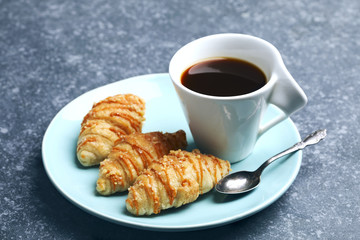 Cup of coffee and salted caramel croissants