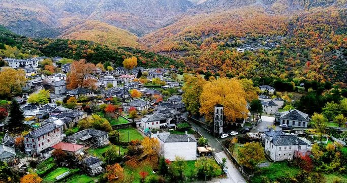 Aerial flight with drone over the old stone houses in the village Papingo, Greece