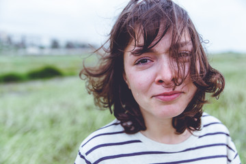 crying girl with disheveled hair outdoor