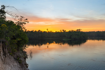 Beautiful sunrise in the amazon jungle, on the Autana river, in southern Venezuela