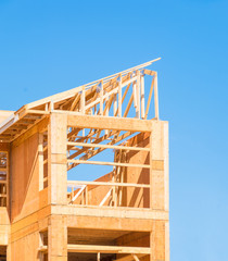 New apartment building under construction on sunny day on blue sky background