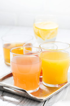 fresh citrus juices in assortment, vertical