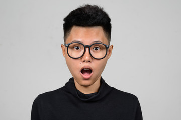 Portrait of Asian young tomboy face looking surprised and shocked