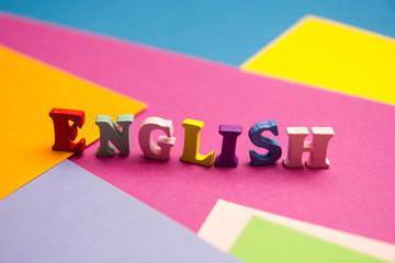 English word composed from colorful abc alphabet block wooden letters, copy space for ad text....