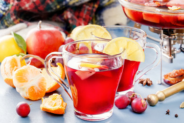 Glass jars with mulled wine. Hot wine for winter. Mulled wine, punch, grog. Hot fruit tea. Spices,...
