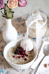 Porridge with red berries and white marshmallows