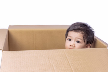 Cute Little Asian Boy  Playing in a box