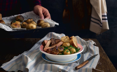 Plate with fresh fried potatoes and meat