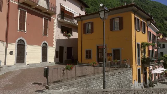Multicolored houses in the town on the shore of Lake Como, Lombardy, Italy, panorama 4k
