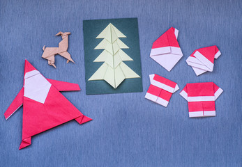 christmas origami craft on blue background