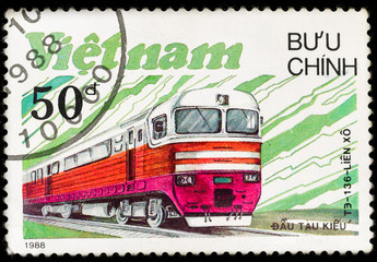 Old vintage postage stamp with soviet locomotive and railway, printed in Vietnam in 1988