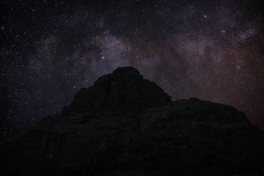 Stars in the night sky over the mountains. View of the Milky Way.