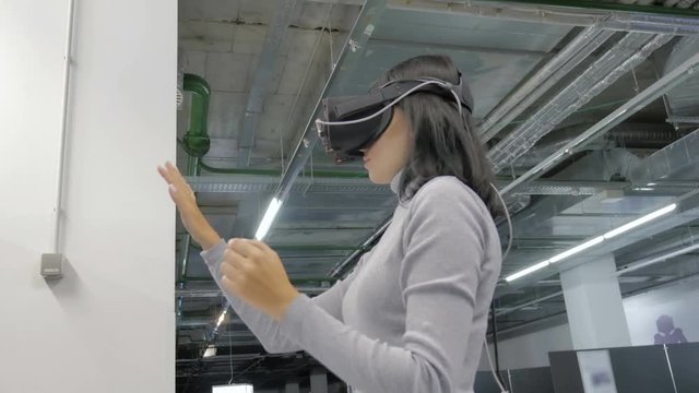 The girl in glasses of a virtual reality.