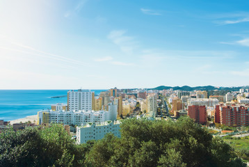 A view to Fuengirola town and its surroundings, hotels, resorts and beaches of Mediterranean sea on sunny day, Andalusia, Spain.