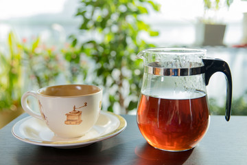 Cup of tea with teapot