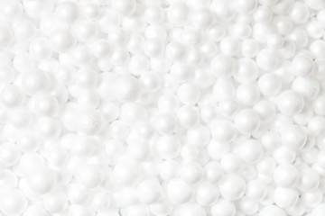 White, gentle texture from polyfoam balls. Abstract background.