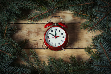 Fototapeta na wymiar Christmas composition. Postcard card for the new year. The clock is almost midnight, the countdown. Spruce branches