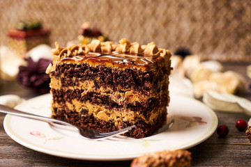 Slice of peanut cake with chocolate