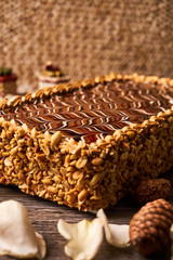 Peanut cake with chocolate and whipped custard cream