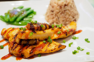 Grilled chicken steak with spicy sauce and rice