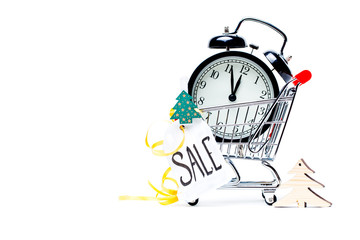 Image of trolley with golden alarm clock, Christmas tree, greeting card, ribbon