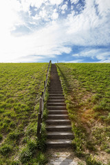 Fototapeta na wymiar Wood stairs and green hills