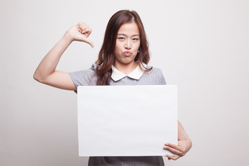 Fototapeta premium Young Asian woman show thumbs down with white blank sign.