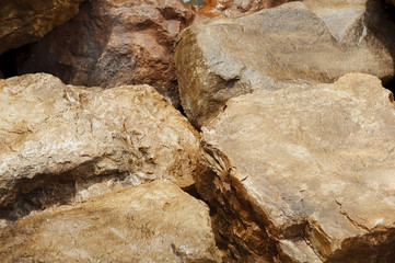 Background and texture of brown grunge rock. The brown rock for decoration in garden at tree market.