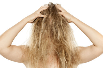 Blonde with messy hair, scratching her scalp - obrazy, fototapety, plakaty