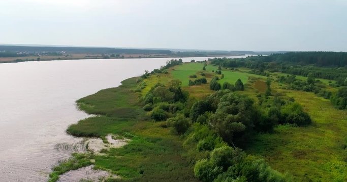 Volga river aerial view from flying quadcopter over forest. Landscape panorama. Beautiful nature. Horizon in the background of fields of meadows and sky.