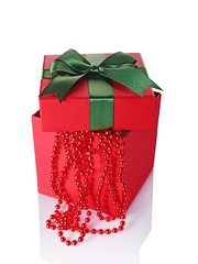 Red classic gift box with green satin bow and beads