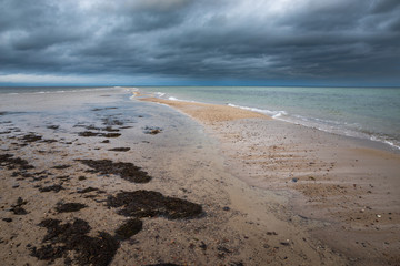 View of the beach on a cloudy day