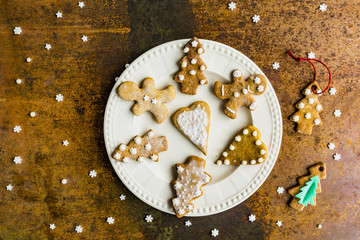 Homemade Christmas gingerbread cookies on vintage background. 

