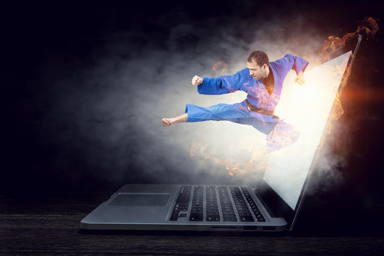 Man in kimono and glowing laptop. Mixed media