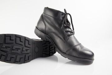 Male black leather boot on white background, isolated product, footwear.