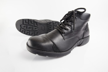 Male black leather boot on white background, isolated product, footwear.