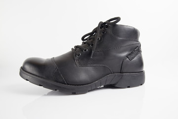 Male black leather boot on white background, isolated product, footwear.