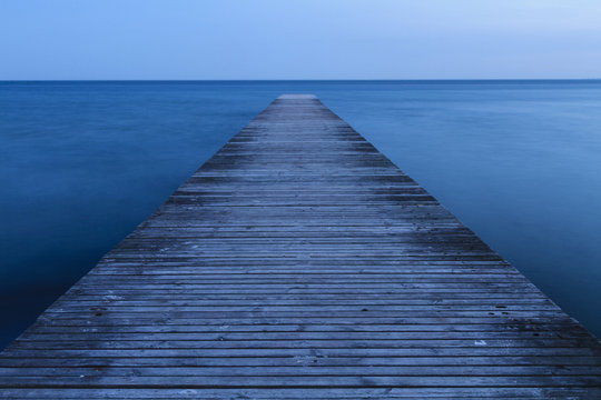 Wooden Jetty at dusk, Fehmarn, Baltic sea, Schleswig-Holstein, Germany
