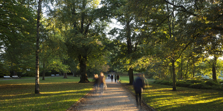 People walking through Schrevenpark, Kiel, Schleswig-Holstein, Germany