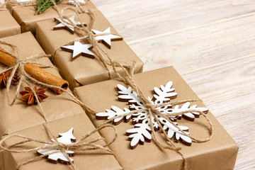 handmade craft christmas gifts or new year rustic presents gifts on wooden background