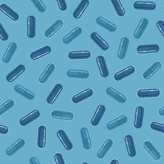 Medical seamless pattern with capsules or pills, vector illustration, light blue background.